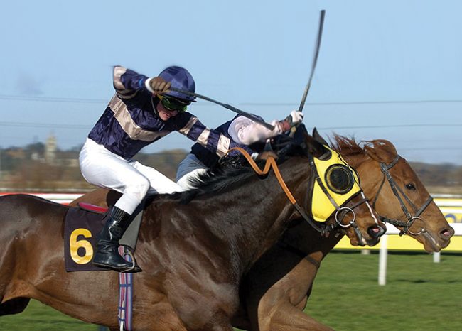race horse being whipped