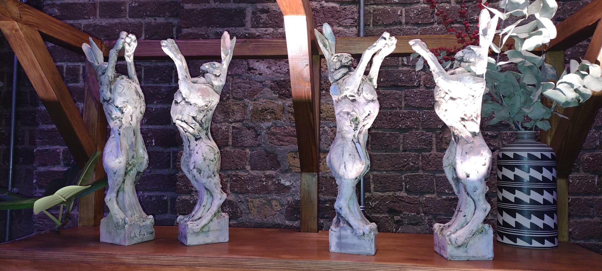 a picture of four statuettes in the shape of a hare. These are given for the different Lush prize categories