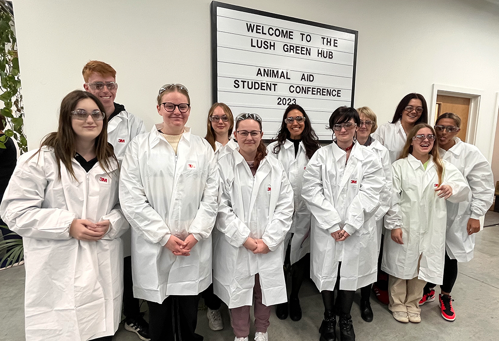 A group of students in white laboratory coats