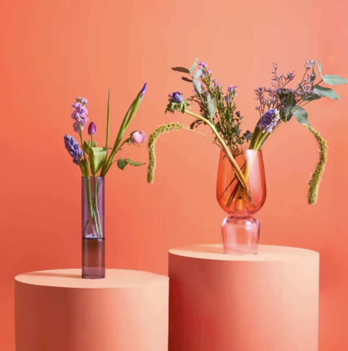 two flower arrangements in vases