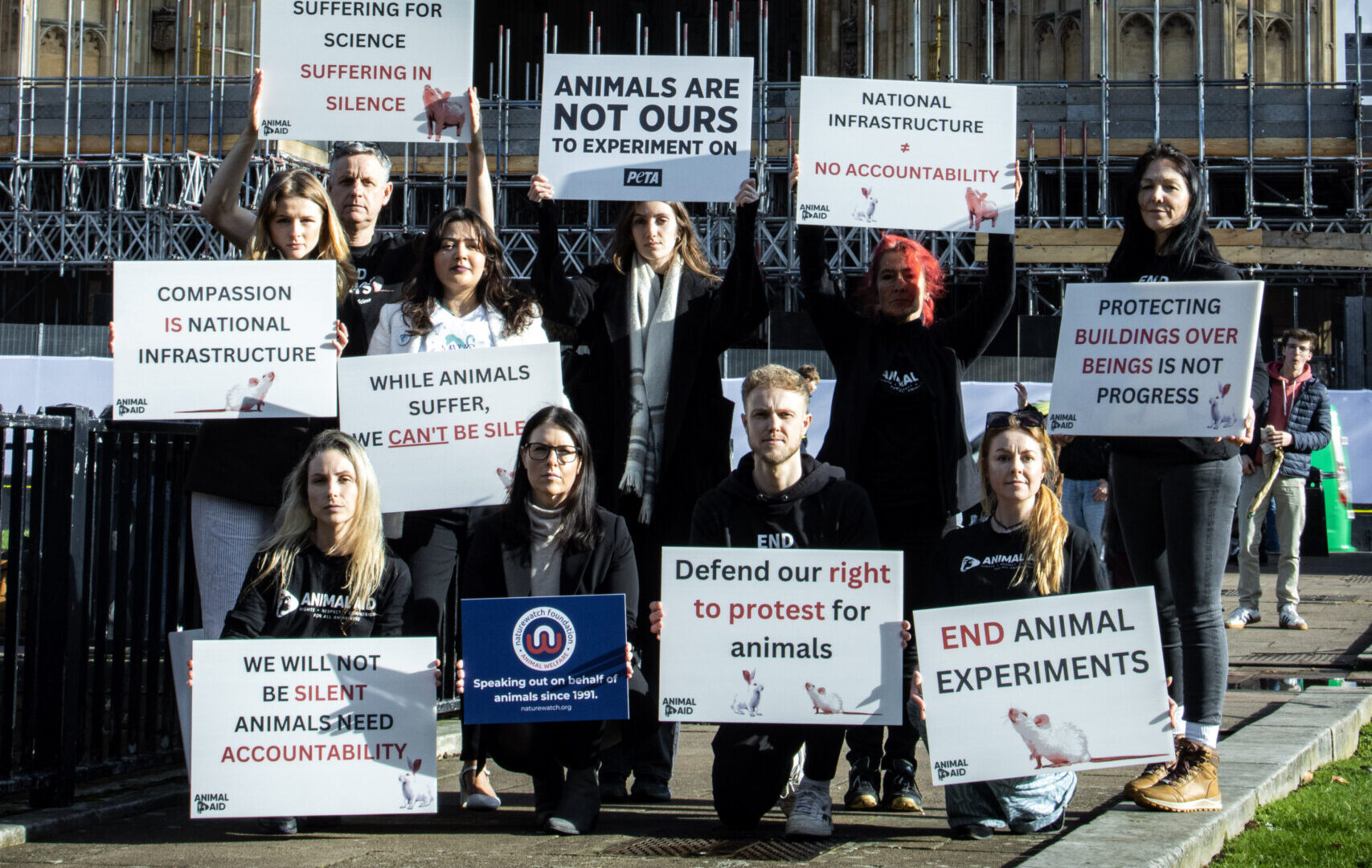 Protestors stand outside houses of parliament