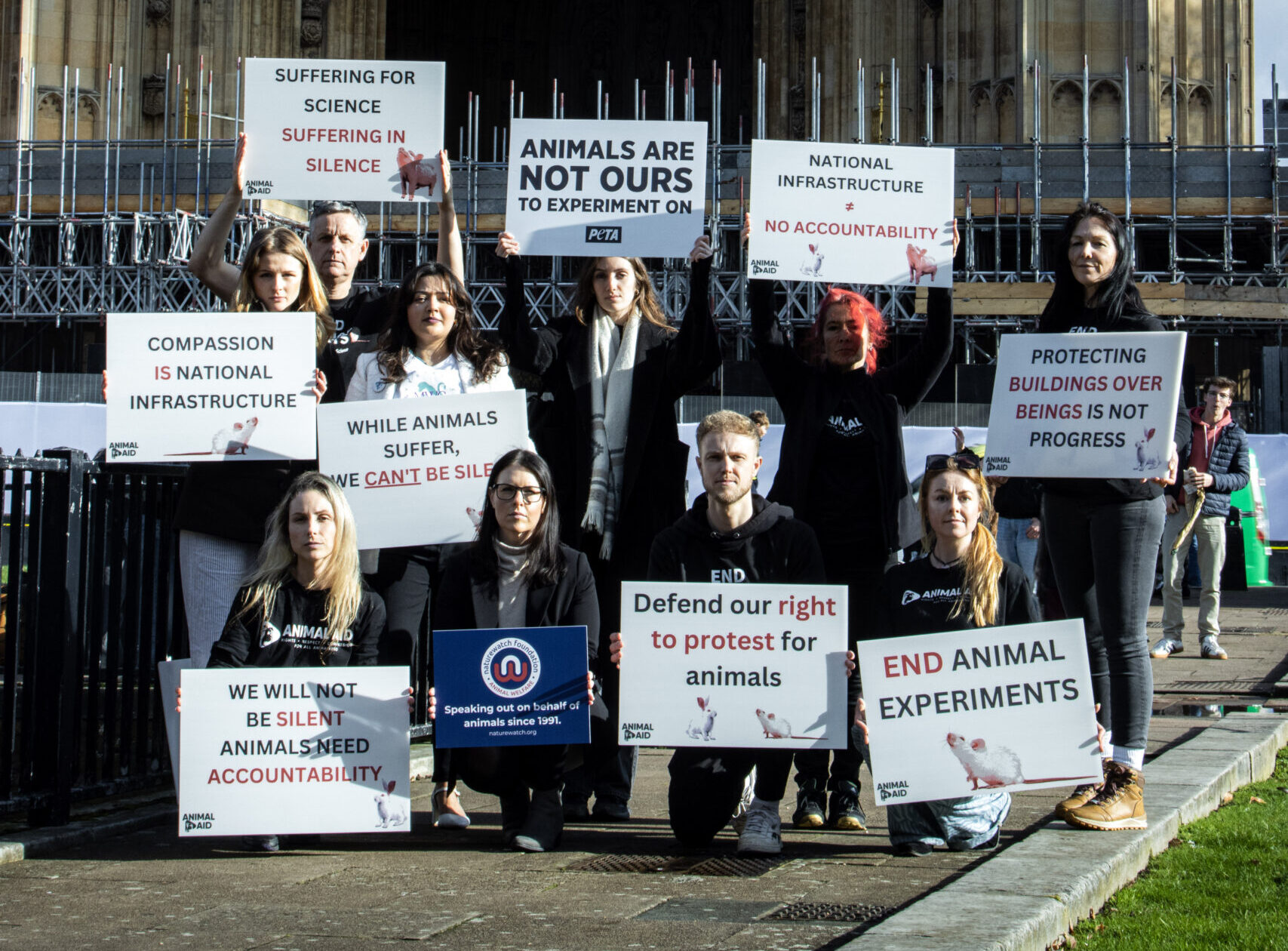 Protestors stand outside houses of parliament
