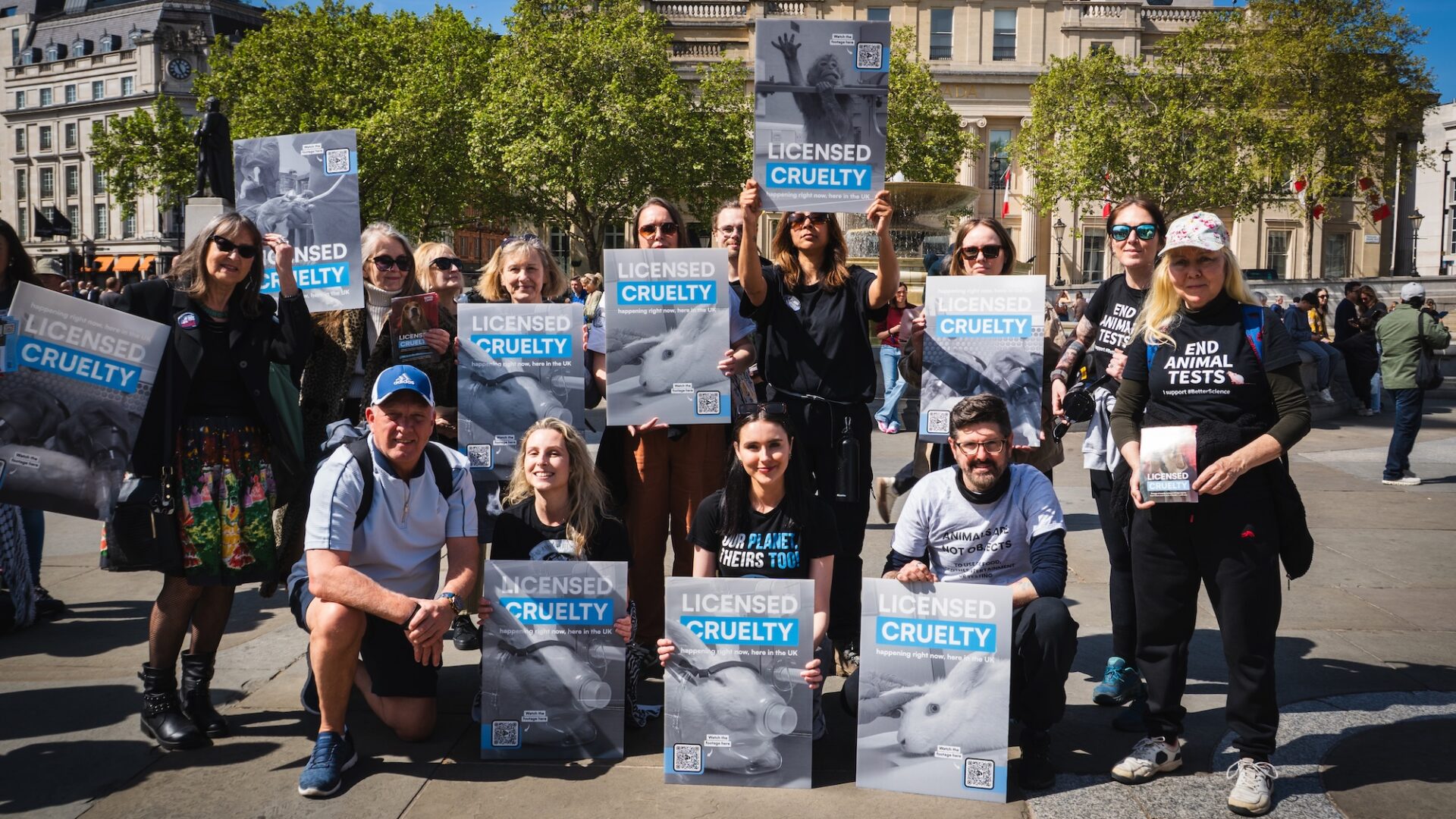 Group of people holding protest signs that say Licensed Cruelty